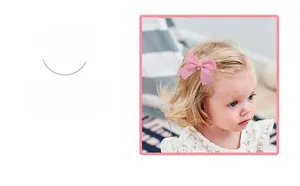 Detailed close-up of a pink waffle plaid fabric bow hair clip for infants and children