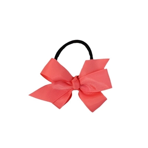 Pink coral grosgrain ribbon bow hair tie with black elastic band on white background