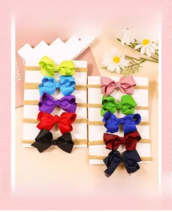 Set of 10 colorful silk-textured bow headbands and elastic hair ties for girls
