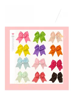Detailed grid showing 12 vibrant colors of large handmade grosgrain ribbon bow hair ties