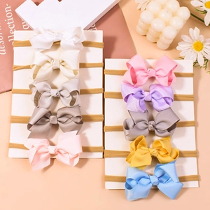 Set of 10 solid color bow headbands for babies with soft elastic nylon hair bands