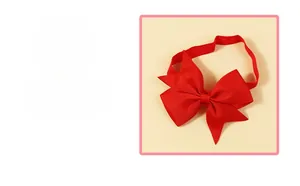 Close-up of red grosgrain ribbon bow headband showing high-quality textured material