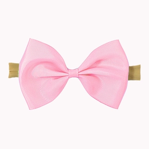 Detail view of pink grosgrain ribbon bow headband with soft elastic band for babies