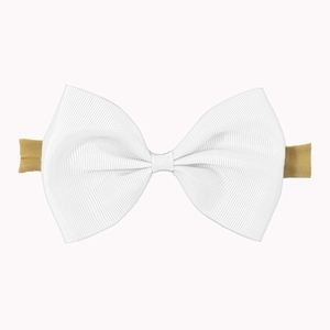 Close-up of white grosgrain bow headband featuring textured ribbon and elastic nude band