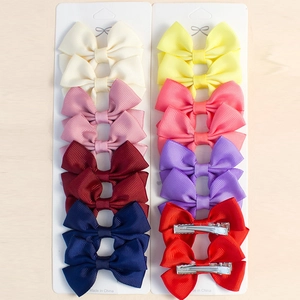 Détail du lot de 20 barrettes à cheveux nœuds en ruban gros-grain sur cartes