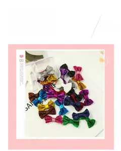 Fiocchi per capelli con paillettes multicolori con una scatola trasparente portaoggetti