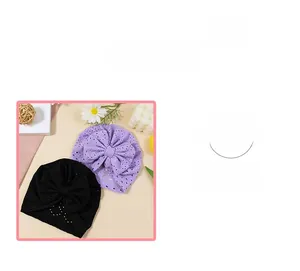 Close-up of soft cotton baby headbands with eyelet hollow fabric and large bow detail