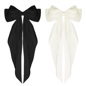 Pair of large satin bow hair clips in black and white with elegant long silk ribbons
