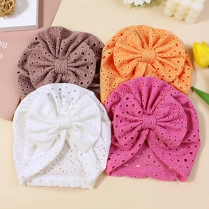 Set of four breathable eyelet fabric baby headbands with large bows in vibrant colors