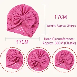 Pink breathable baby headband with large bow detail and hollow eyelet knit texture