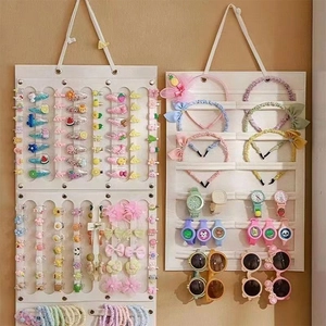 Dual white felt wall organizers for hair clips, headbands, watches, and sunglasses storage