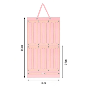 Pink felt wall organizer for girls hair accessories, dimension 65cm by 35cm with hanging straps