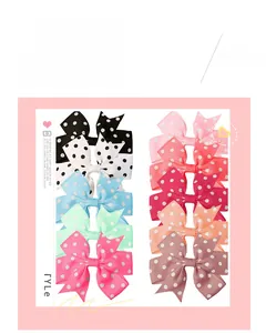 Detailed grid of colorful polka dot grosgrain ribbon bow clips with various vibrant patterns