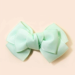 Mint green handmade grosgrain ribbon bow hair clip with textured ribbed fabric
