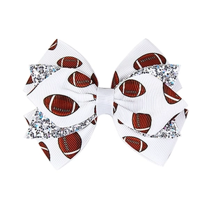 White ribbed ribbon hair clip with American football print and silver sequin detail