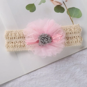Soft beige lace baby headband featuring large pink mesh flower for photography