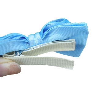Blue mesh bow hair clip for girls featuring white pearls and a metal alligator clip