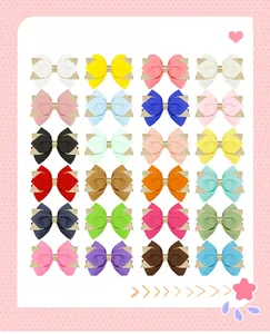 Vue détaillée de 24 couleurs de barrettes à nœud avec bordures dorées scintillantes