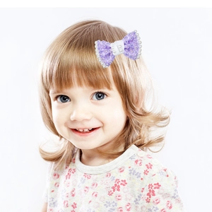 Handmade purple bow hair clip for girls with elegant pearls and sparkling rhinestones