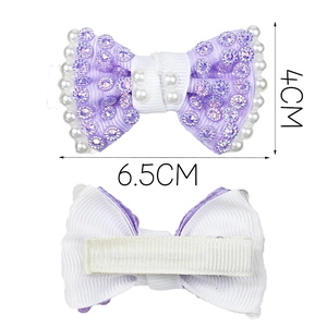 Handmade purple bow hair clip with pearls and rhinestones shown in front and back views