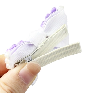 Handmade white bow hair clip with purple flowers and pearls for girls' hair styling
