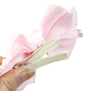 Pink ribbon bow hair clip with faux pearl trim and non-slip ribbon wrapped metal duckbill
