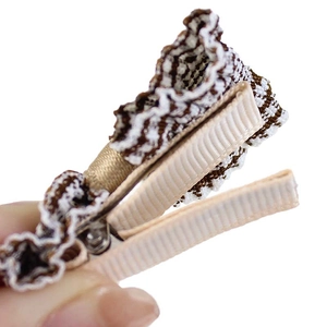 Handmade fabric bow hair clip with brown plaid and lace detail for kids in neutral tones