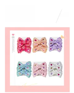 Détails de six paires de barrettes à cheveux avec nœuds faits main et cristaux strassés