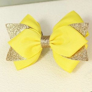 Pince à cheveux noeud jaune en gros-grain fait main avec centre scintillant doré brillant