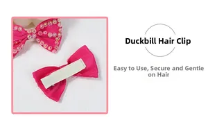 Detail of pink rhinestone bow hair clip showing front and non-slip metal duckbill grip
