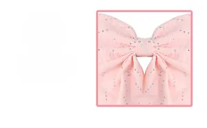 Close-up of pink bow hair clip featuring handmade silver rhinestones and fine fabric texture