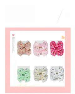Set of six colorful handmade hair clips with rhinestones and star charms in pastel tones