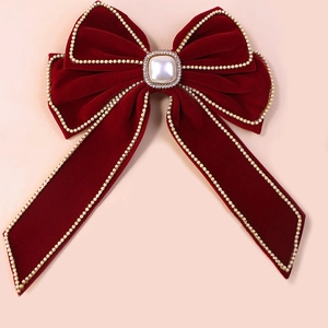 Elegant burgundy velvet bow hair clip with pearl trim and central rhinestone ornament