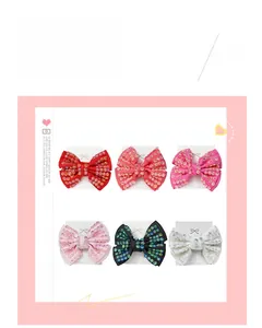 Detailed set of six handmade rhinestone bow hair clips in various colors with duckbill base