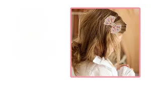 Pink handmade bow hair clip for girls featuring sparkling star rhinestones and pearls