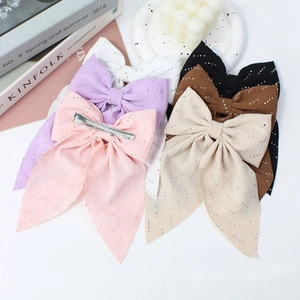 Sparkling rhinestone bow hair clips in multiple colors with steady duckbill metal clamps