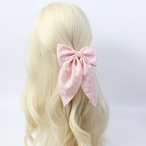 Elegant pink handmade bow hair clip with sparkling rhinestones and long flowing ribbons