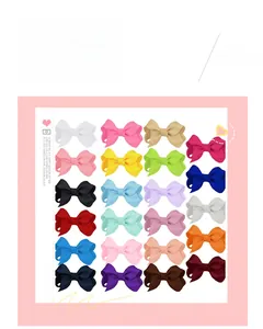 Close-up of 24 colorful ribbed fabric hair bows in a variety of vibrant pastel colors