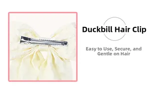 Detail view of cream white lace fabric duckbill hair clip with durable metal fastener