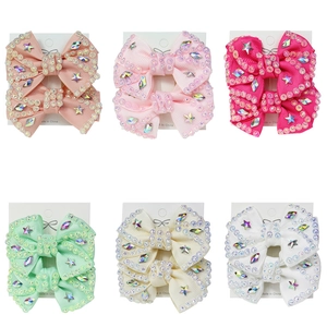 Set of six handmade ribbon bow hair clips with rhinestones and star-shaped gems
