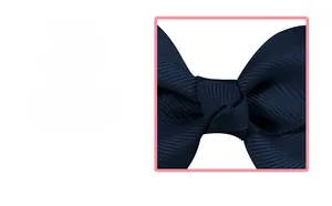 Detail showing the ribbed texture and craftsmanship of the dark blue grosgrain bow