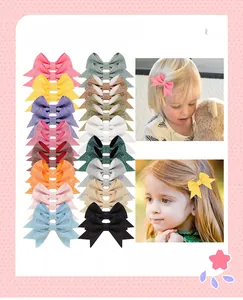 Close-up of glitter sequins bowtie hair clips in 18 colors for kids and little girls