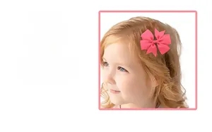 Close-up of pink grosgrain ribbon swallowtail hair bow showing texture and handcrafted detail