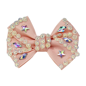 Pink grosgrain ribbon bow hair clip with sparkling star rhinestones on white background