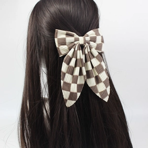Barrette à cheveux élégante avec grand nœud à carreaux et texture en velours côtelé