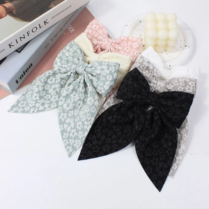 Handmade large lace bow hair clips in five colors including pink, yellow, and blue