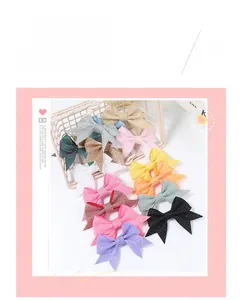 Close-up of glitter sequin bow hair clips in multiple colors for girls hair decoration
