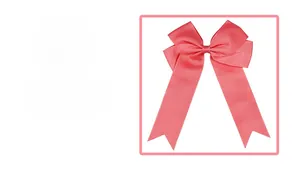 Close-up of pink grosgrain bow hair clip featuring ribbed texture and swallowtail tails