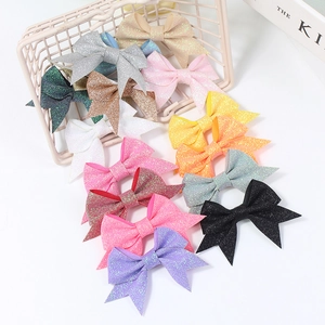Colorful glitter sequin bow hair clips for kids in various vibrant shades and styles