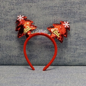 Detail of red sequin Christmas tree headband with snowflakes and Merry Christmas text